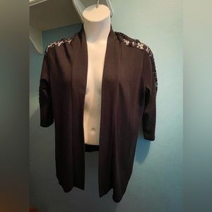 1X open front black cardigan with lace inset sleeves, lightweight material.